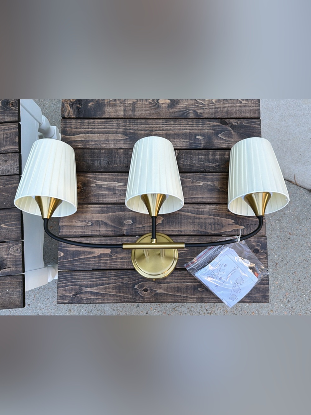 25” 3-Light Wall Sconce with Cream Shades and Brass & Black Accents